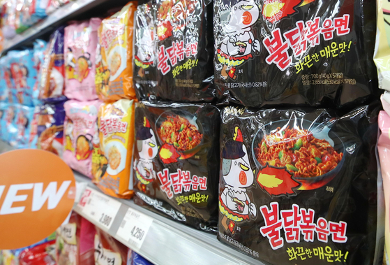Buldak Bokkeummyeon is displayed at a big discount mart in downtown Seoul on Monday. A total of three billion packets of Buldak Bokkeummyeon have been sold in the nine years since the spicy chicken ramyeon was first introduced in 2012, according to Samyang Foods on Monday. [YONHAP]