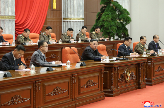 North Korean leader Kim Jong-un, center front, calls out senior officials for causing a ″great crisis″ endangering the safety of the country in its Covid-19 prevention efforts in a Politburo meeting of the ruling Workers’ Party, reported its official Korean Central News Agency Wednesday. [YONHAP]