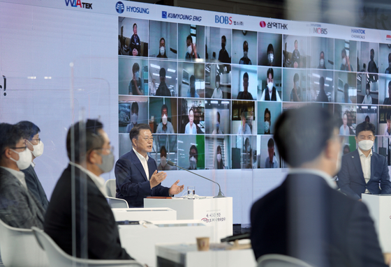 President Moon Jae-in speaks at an event reviewing the outcome of the second year of Japan's export curbs on Korea at Coex in Gangnam District, southern Seoul, on Friday, attended by representatives of the materials, components and equipment sector. [JOINT PRESS CORPS]