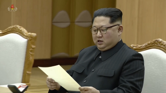 In this file photo, North Korean leader Kim Jong-un reads a letter from President Moon Jae-in on March 6, 2018. [YONHAP]