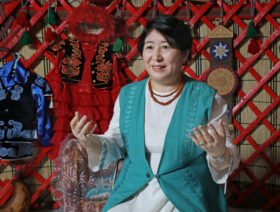 Dinara Kemelova, ambassador of the Kyrgyz Republic to Korea, speaks with the Korea JoongAng Daily at an exhibition on the country's tourism at Coex in southern Seoul on June 25. [PARK SANG-MOON]