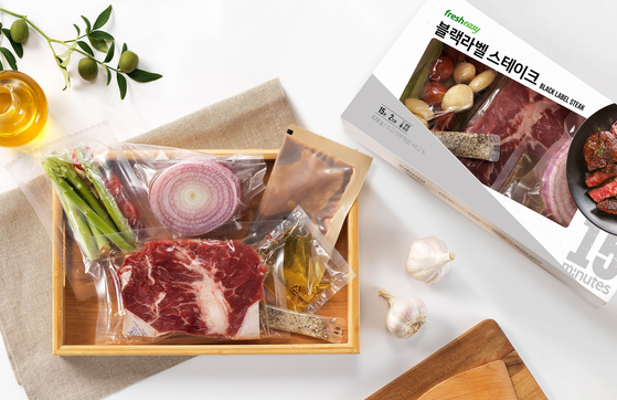 A steak meal kit sold by Fresh Easy. The kit includes a cut of beef, asparagus, garlic, red onions, steak sauce, olive oil and herb salt. [FRESH EASY]