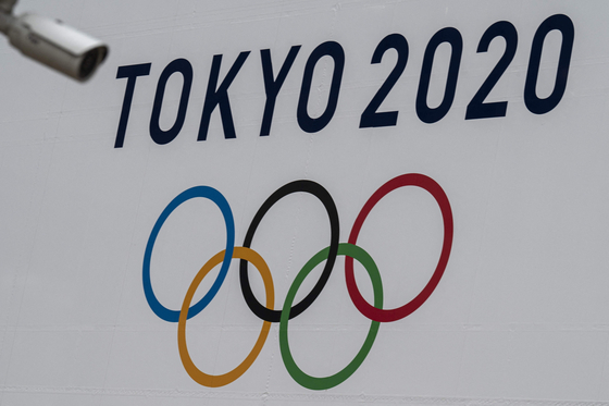 The Tokyo 2020 Olympics Games banner is displayed on a wall Tokyo in April. [AFP/YONHAP]