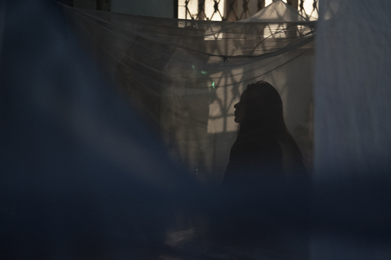 Top and above: Scenes of Narilya Gulmongkolpech as Mink in “The Medium” as she becomes possessed by evil spirits because of a family curse. [SHOWBOX]