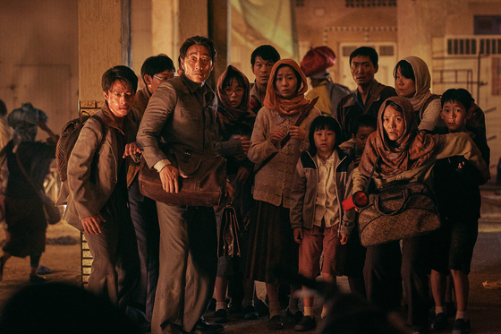 Actor Huh Joon-ho as the formidable but caring North Korean ambassador who works hard to protect his family and embassy workers. [LOTTE ENTERTAINMENT]         