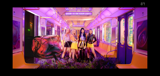 In girl group aespa’s music video for “Black Mamba” (2020), a giant serpent named Black Mamba is the villain that the group’s members must fight against. [SCREEN CAPTURE]