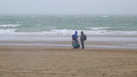 A scene at the end of the film when the family goes out for an outing to a beach in Dunkirk, France. ParkKang said her vision of a conventional family involved them standing hand in hand on a beach or at an aquarium. [JINJIN PICTURES]