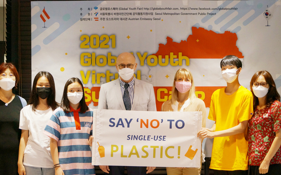 Ambassador of Austria to Korea Wolfgang Angerholzer, fourth from right; Irene Nuutila, a public speaker on plastics and environments, third from right; Lee Bock-hee, founder of the Global Youth Fair, far left; and some participants of the 2021 Global Youth Virtual Summer Camp, an annual conference for students in Korea to hear from international speakers on a number of issues such as climate change, pose together following the conference on Saturday. [GLOBAL YOUTH FAIR]