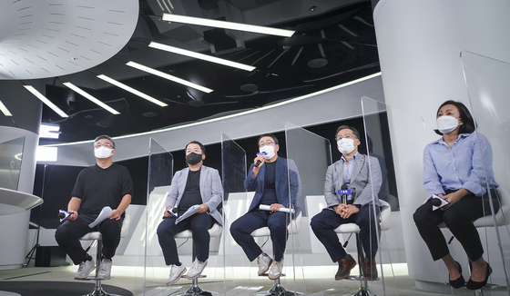 Managers at SK Telecom sit down for a press conference on Wednesday introducing the company's new subscription business ″T Universe.″ [SK TELECOM]
