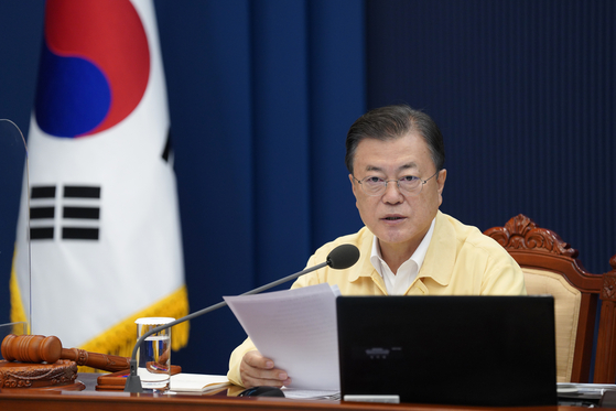 President Moon Jae-in announces the 2022 budget proposal during a cabinet meeting on Tuesday at the Blue House.[YONHAP] 