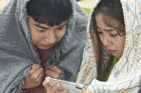 A scene from film "Show Me the Ghost" with actor Han Seung-yeon, right [INDIESTORY]