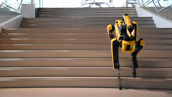 Four-legged Spot climbs up the stairs during a demonstration on Sept. 10. [HYUNDAI MOTOR]