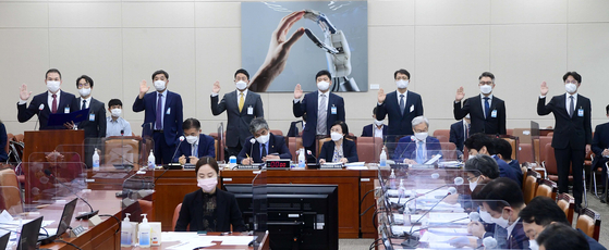 Managers of major tech companies before answering questions at the Science, ICT, Broadcasting and Communications Committee during the National Assembly audit held on Tuesday. From left are country director of Google Korea Kim Kyoung-hoon, CEO of Facebook Korea Jung Ki-hyun, representative director of TBS Lee Kang-taek, general manager of Apple Korea Brandon Yoon, public policy lead at Netflix Yeon Joo-hwan, representative director of Coupang Park Dae-jun, CEO of Kakao Mobility Ryu Gung-seon and CEO of Woowa Brothers Kim Beom-jun. [JOINT PRESS CORPS]