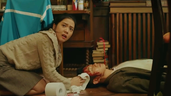 Young-ro mistakes Soo-ho for a pro-democracy protester running from the police and harbors him in her dormitory. Soo-ho is in fact being hunted down by the South Korean intelligence agency. [SCREEN CAPTURE]