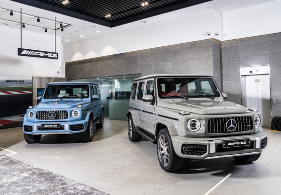  Two G 63 Hyosung are shown on display Thursday. The Class Hyosung, the official Mercedes-Benz dealer, disclosed the limited model of the high-performance SUV, of which only 10 will be on sale in Korea. The SUV comes in two colors — China Blue and Classic Grey. [THE CLASS HYOSUNG] 
