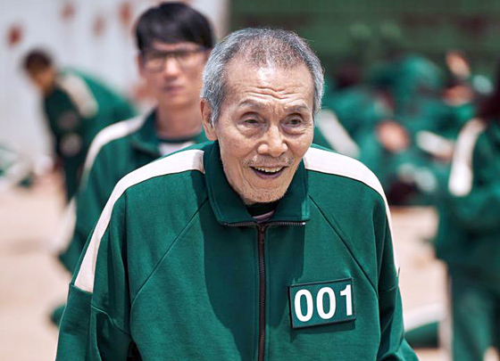 A Scene from "Squid Game" featuring Oh Young-soo as the character Oh Il-nam, or the player No. 1 [NETFLIX]