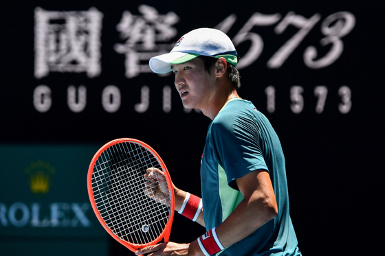 Kwon Soon-woo reacts after scoring a point against Canada's Denis Shapovalov during their men's singles match on day three of the Australian Open in Melbourne on Wednesday. [AFP/YONHAP]