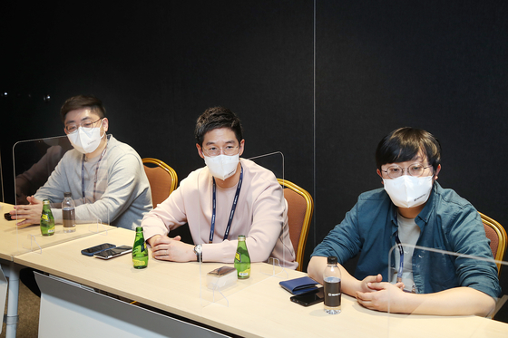 Engineers at Kakao Mobility talk about the company's gaols for this year during an interview with the local press on Thursday. From left are: Hong Seung-hwan, tech leader at the digital twin team; Christopher Chang, the managing director of the company's research lab The New Squad; and Park Chang-soo, the tech leader at the autonomous software team. [KAKAO MOBILITY]