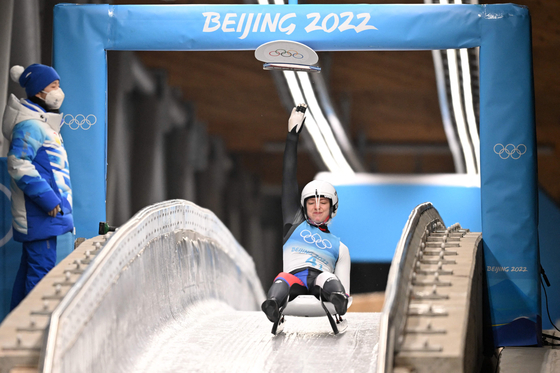 Korean luger Aileen Christina Frisch touches the pad in the luge team relay during the Beijing 2022 Winter Olympic Games, at the Yanqing National Sliding Centre on Thursday. [YONHAP]
