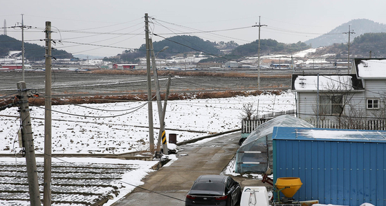 A solar power plant construction site is located between residential areas at Sinmyeong Village, Sinan County. [JANG JEONG-PIL]