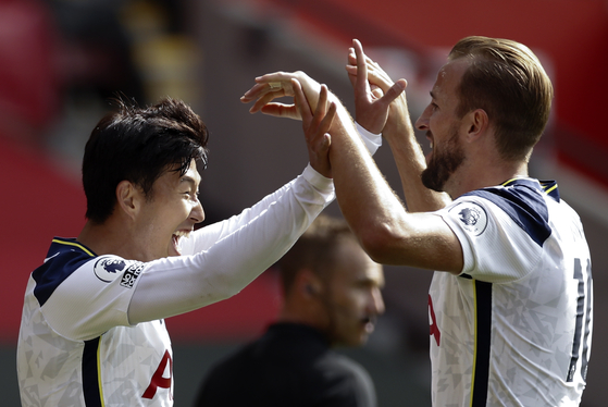 Tottenham Hotspur's Son Heung-min celebrates with Harry Kane after scoring his third goal during a match against Southampton in Southampton, England on, Sept. 20, 2020. [EPA/YONHAP]