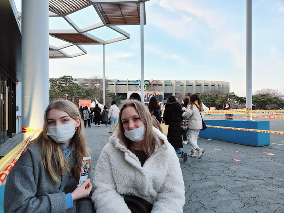 Many fans who were unable to purchase tickets sat outside the venue to watch the livestreamed concert on their personal devices. [HALEY YANG]