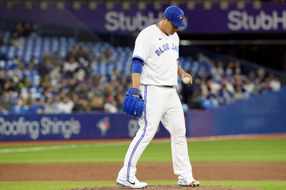 Toronto Blue Jays starting pitcher Ryu Hyun-jin looks on from the mound after giving up a two-run homer to Oakland Athletics catcher Sean Murphy during the third inning of a game in Toronto on Saturday. [AP/YONHAP]
