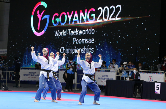 Iranian athletes compete in a recognized poomsae preliminary match at the Goyang 2022 World Taekwondo Poomsae Championships on Thursday at Kintex Exhibition Hall in Goyang, Gyeonggi. The Poomsae Championships run from Thursday through Sunday. [YONHAP]