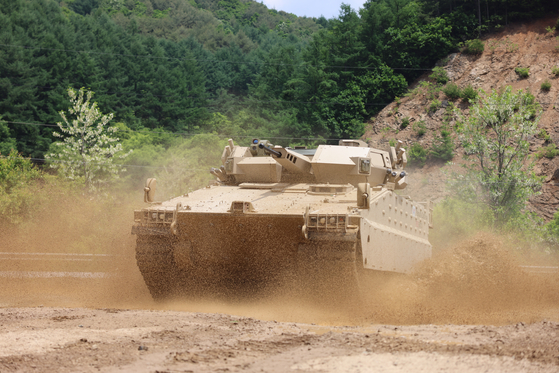 A Redback drives over a ditch during field maneuvers on a obstacle course on Friday. [HANWHA DEFENSE]