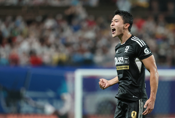 Cho Gue-sung celebrates after scoring Team K League's first goal in an exhibition game against Tottenham Hotspur at Seoul World Cup Stadium in Mapo District, western Seoul on Wednesday. [YONHAP]