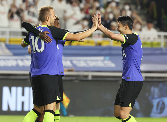 Harry Kane, left, and Son Heung-min celebrate after Kane scores the opening goal in a friendly between Tottenham Hotspur and Sevilla at Suwon World Cup Stadium in Suwon, Gyeonggi on Saturday. [YONHAP]