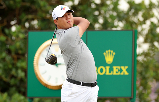 Kim Si-woo tees off on the third hole during the final round of The 150th Open Championship on The Old Course, St Andrews, Scotland on Sunday. [REUTERS/YONHAP]