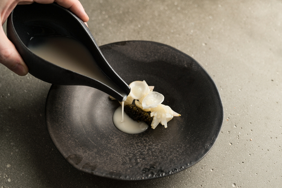A dish at Atomix, a fine dining restaurant in New York that offers modern style Korean food [DIANE KANG]