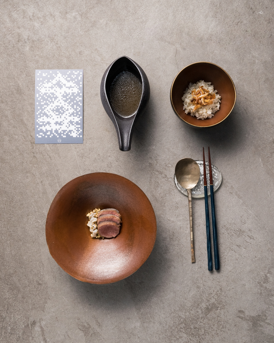 Atomix provides a menu with Korean words to better explain the dishes it offers [DIANE KANG]