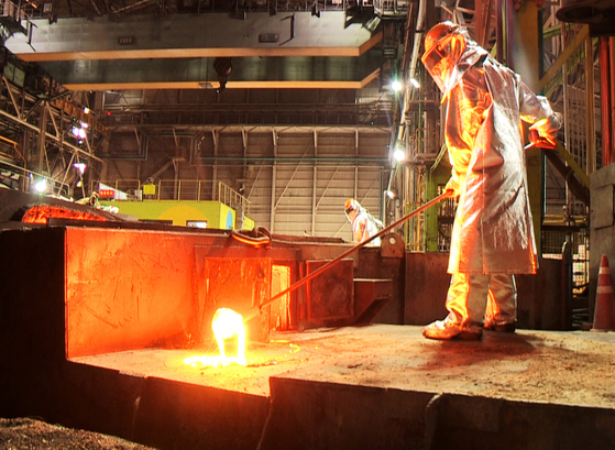 A Posco employee working in a steel mill in Pohang [YONHAP]