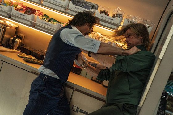 Ladybug finds out that the bullet train that he boarded on is full of killers with their eyes on a briefcase he is carrying. In this scene, another assassin codenamed Tangerine, portrayed by Aaron Taylor-Johnson, attempts to wrestle information out of Ladybug to find the briefcase. [SONY PICTURES]