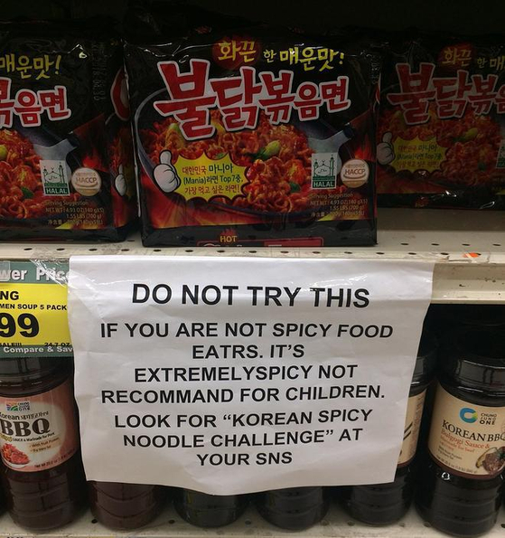 A sign warns buyers of Buldak Ramen about its spiciness [SCREEN CAPTURE]