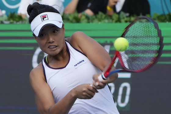 Jeong Bo-young returns a shot to Jelena Ostapenko of Latvia during the first round of the Korea Open at the Olympic Park Tennis Center in Songpa District, southern Seoul on Tuesday. [AP/YONHAP] 