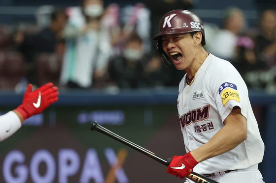Song Sung-mun of the Kiwoom Heroes celebrates after hitting a two-run home run against the KT Wiz during fourth inning of Game 5 of the first round of the KBO playoffs at Gocheok Sky Dome in western Seoul on Saturday.  [YONHAP]