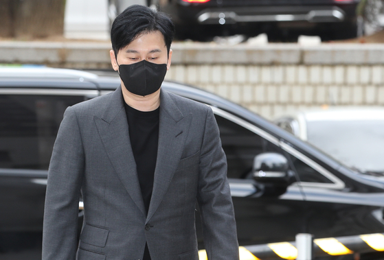 Former YG Entertainment CEO Yang Hyun-suk attends his trial at Seoul District Court in Seocho District, southern Seoul, on Monday [NEWS1]