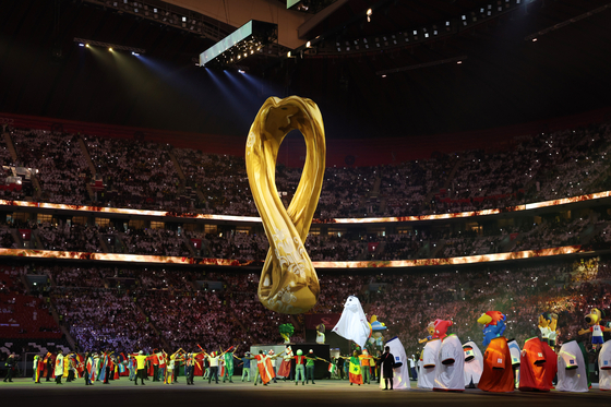 Dancers perform during the opening ceremony for the 2022 Qatar World Cup at Al Bayt Stadium on Sunday.  [XINHUA/YONHAP]