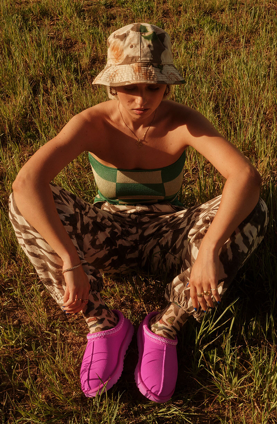 These pink UGG slippers are currently one of the brand's trendiest items. [UGG]