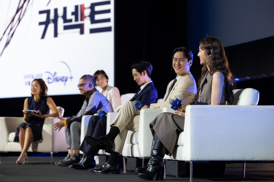 The cast of "Connect" and Japanese director Takashi Miike speak about the series at the Disney Content Showcase held at Marina Bay Sands Singapore on Friday. [THE WALT DISNEY COMPANY]