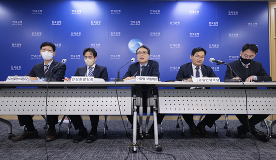 Bank of Korea Deputy Gov. Lee Jong-ryeol, center, speaks at a press conference held to discuss Korea’s financial stability in central Seoul on Thursday. [YONHAP]
