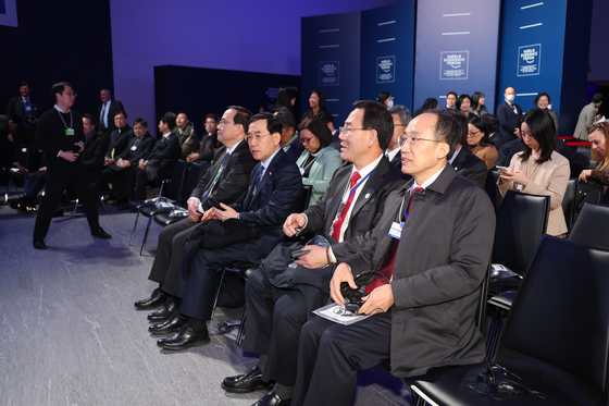 Choo Kyung-ho, Minister of Finance, first from the right, waits for President Yoon Suk Yeol's speech at the World Economic Forun in Davos, Switzerland, on Thursday. [YONHAP]