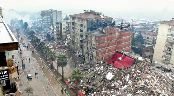 Buildings in Kahramanmaras, Turkey, are damaged after the impact from a 7.8-magnitude earthquake struck the city on Monday. [REUTERS]