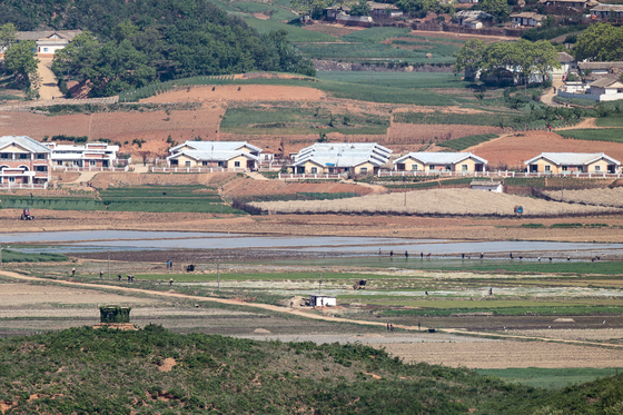 North Koreans farm in North Hwangahae on May 13, 2022. [YONHAP]
