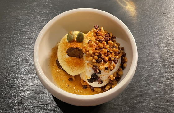 Lobster and rice together with gochujang sauce, top, at Mingles, and the restaurant's signature Jang Trio dessert, above [LEE SUN-MIN]