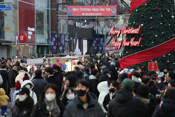 A crowd of people are seen on a street in Myeong-dong, central Seoul, on Dec. 25, 2022. [YONHAP] 