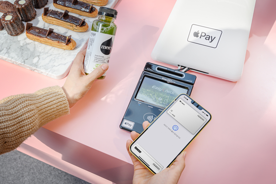 An image of Apple Pay processing through an iPhone [APPLE]